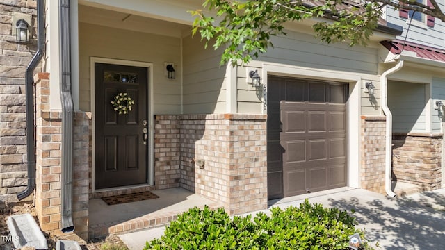 506 Oak Forest View Ln, Wake Forest, NC 27587 - entrance to property featuring brick siding, an attached garage, and a porch