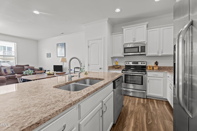 506 Oak Forest View Ln, Wake Forest, NC 27587 - kitchen with stainless steel appliances, a sink, ornamental molding, dark wood-style floors, and open floor plan