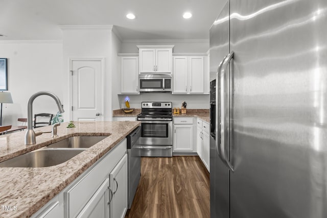 506 Oak Forest View Ln, Wake Forest, NC 27587 - kitchen with appliances with stainless steel finishes, a sink, white cabinets, crown molding, and dark wood-style floors