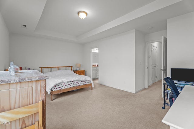 506 Oak Forest View Ln, Wake Forest, NC 27587 - bedroom with light colored carpet, baseboards, a tray ceiling, and connected bathroom