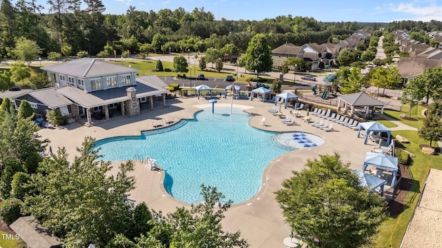 506 Oak Forest View Ln, Wake Forest, NC 27587 - community pool featuring a gazebo, a patio area, and view of scattered trees