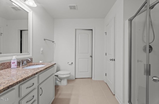 506 Oak Forest View Ln, Wake Forest, NC 27587 - bathroom with vanity, a shower stall, toilet, and tile patterned flooring