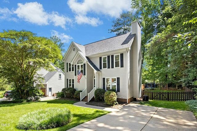 6912 Baywood Dr, Raleigh, NC 27613 - traditional home with a chimney and a shingled roof