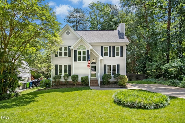 6912 Baywood Dr, Raleigh, NC 27613 - view of front of house with a chimney and roof with shingles