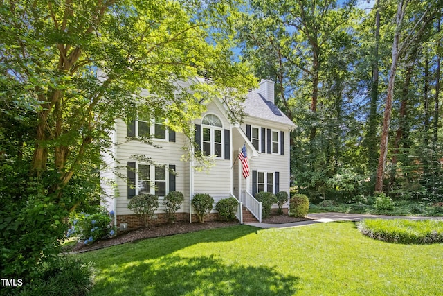6912 Baywood Dr, Raleigh, NC 27613 - view of front of property featuring a chimney and a front lawn