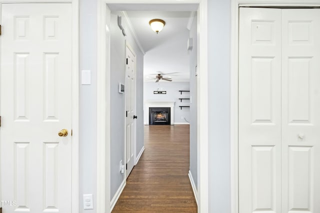 6912 Baywood Dr, Raleigh, NC 27613 - hallway with dark wood-style floors, baseboards, and crown molding
