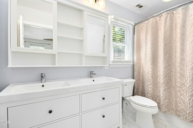 6912 Baywood Dr, Raleigh, NC 27613 - bathroom featuring double vanity, toilet, marble finish floors, and a shower with curtain
