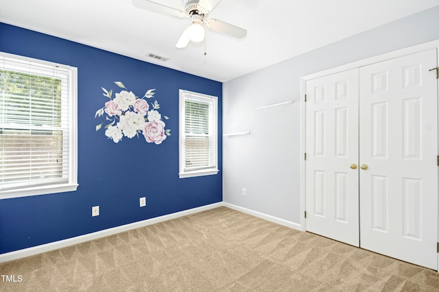 6912 Baywood Dr, Raleigh, NC 27613 - unfurnished bedroom with carpet flooring, a closet, baseboards, and ceiling fan