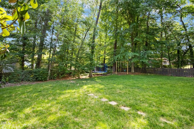 6912 Baywood Dr, Raleigh, NC 27613 - view of yard featuring a trampoline