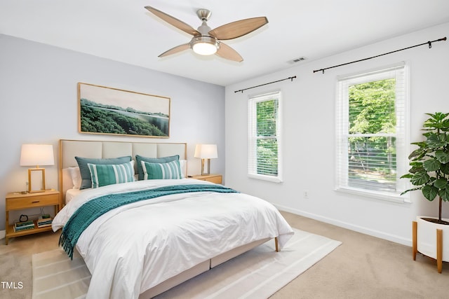 6912 Baywood Dr, Raleigh, NC 27613 - bedroom with light carpet, baseboards, and a ceiling fan