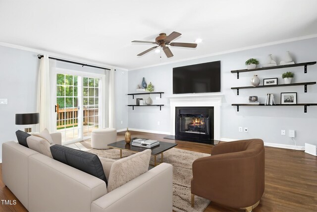 6912 Baywood Dr, Raleigh, NC 27613 - living room featuring ornamental molding, wood finished floors, a ceiling fan, a lit fireplace, and baseboards