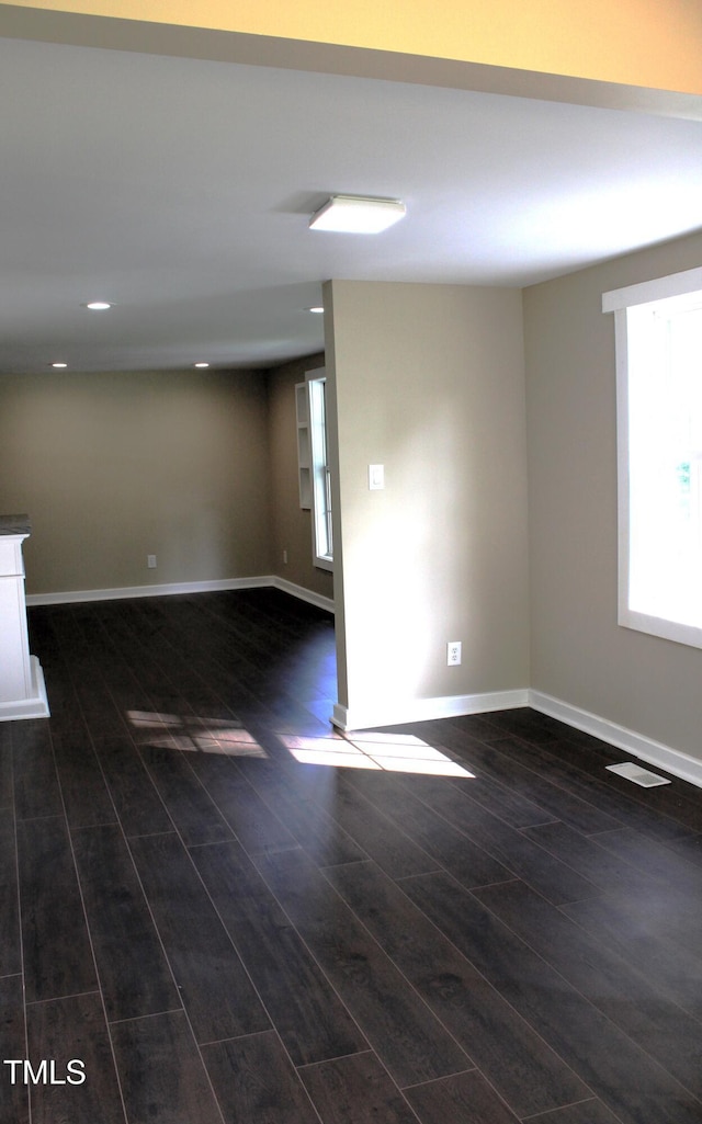 10180 Buffalo Rd, Clayton, NC 27527 - unfurnished room featuring dark wood-style flooring, baseboards, and recessed lighting