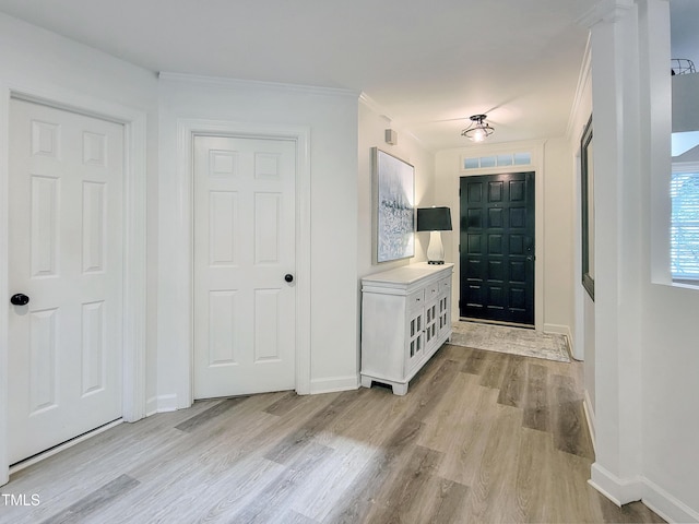 107 Long Shadow Ln, Cary, NC 27518 - entryway with light wood-style flooring, baseboards, and crown molding