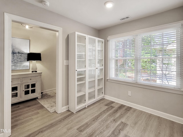107 Long Shadow Ln, Cary, NC 27518 - unfurnished bedroom featuring wood finished floors and baseboards