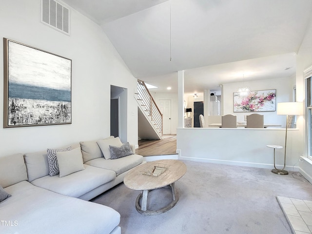 107 Long Shadow Ln, Cary, NC 27518 - living area featuring stairs, carpet, baseboards, and vaulted ceiling