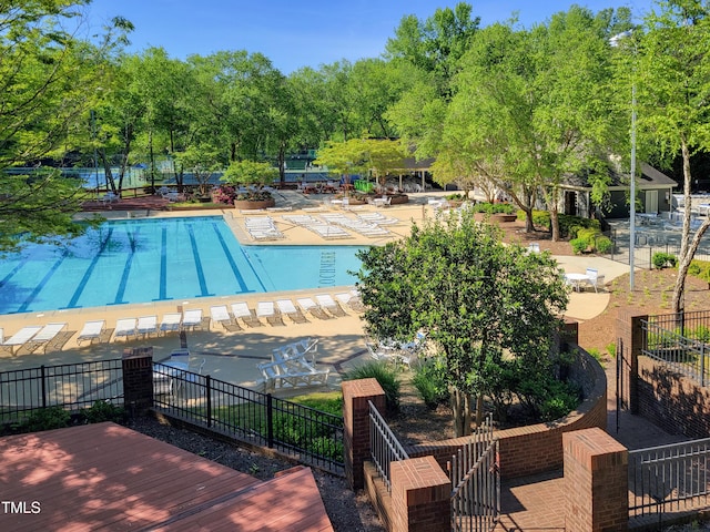 107 Long Shadow Ln, Cary, NC 27518 - community pool featuring view of scattered trees and a patio area