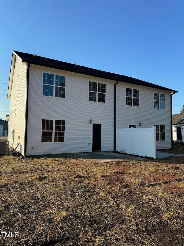 back of house with central AC and a patio area