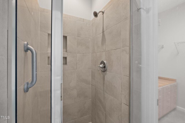256 Rubrum Dr, Hillsborough, NC 27278 - bathroom with a shower stall and a walk in closet