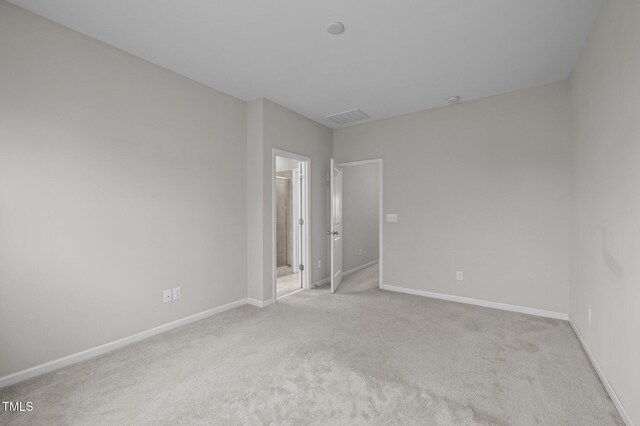 256 Rubrum Dr, Hillsborough, NC 27278 - spare room featuring baseboards and light carpet