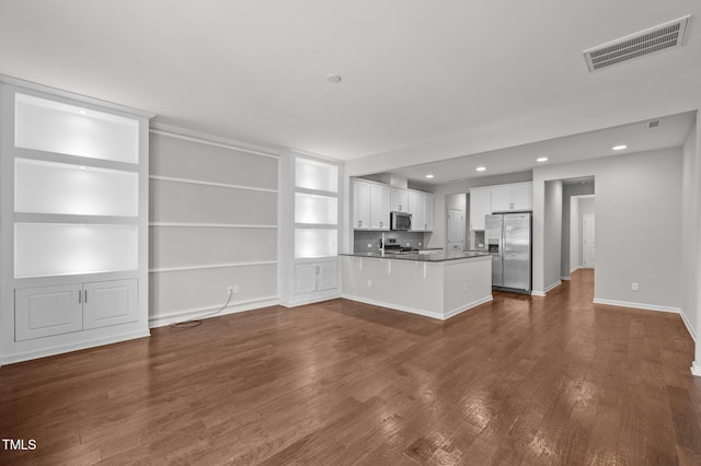 256 Rubrum Dr, Hillsborough, NC 27278 - unfurnished living room featuring recessed lighting, dark wood-style flooring, and built in features