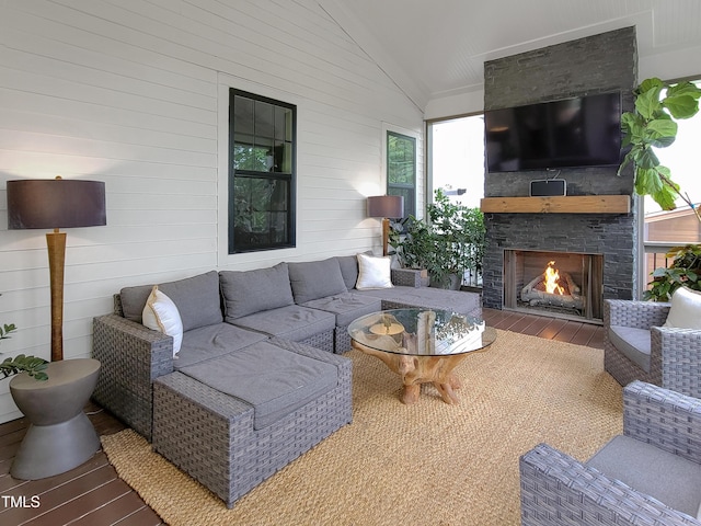 3160 Mantle Ridge Dr, Apex, NC 27502 - living area featuring wood-type flooring, vaulted ceiling, and a fireplace