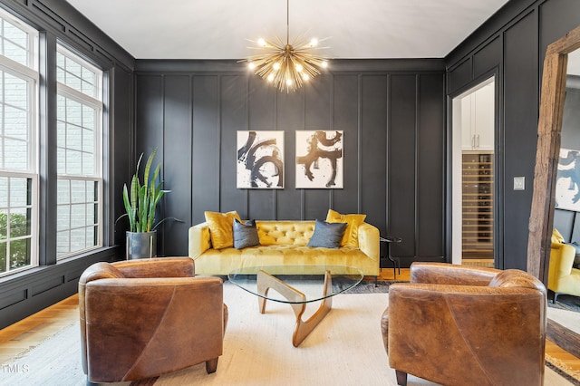 3160 Mantle Ridge Dr, Apex, NC 27502 - living area featuring a decorative wall, wood finished floors, and a chandelier