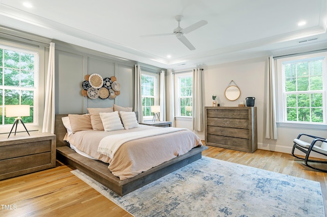 3160 Mantle Ridge Dr, Apex, NC 27502 - bedroom with multiple windows, light wood-style floors, recessed lighting, and baseboards