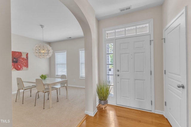 711 Keystone Park Dr Unit 7, Morrisville, NC 27560 - foyer with arched walkways, baseboards, and light wood-type flooring