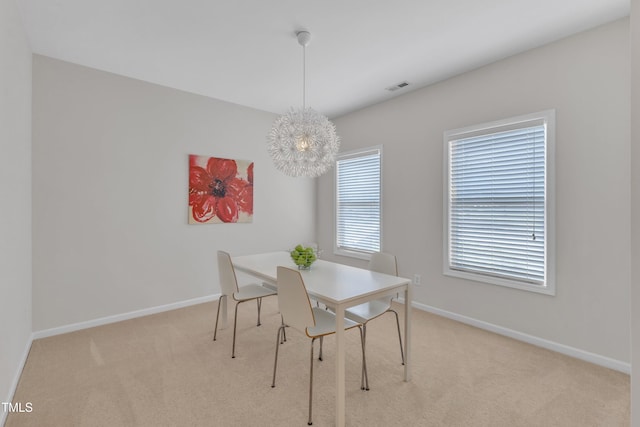 711 Keystone Park Dr Unit 7, Morrisville, NC 27560 - dining room featuring carpet flooring, baseboards, and a chandelier