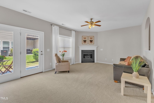 711 Keystone Park Dr Unit 7, Morrisville, NC 27560 - carpeted living area with ceiling fan, baseboards, and a fireplace