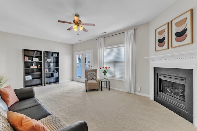 711 Keystone Park Dr Unit 7, Morrisville, NC 27560 - living area featuring carpet, a ceiling fan, a fireplace, and baseboards