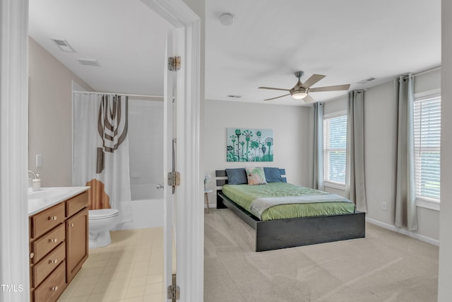 711 Keystone Park Dr Unit 7, Morrisville, NC 27560 - bedroom with multiple windows, a sink, ensuite bath, and baseboards