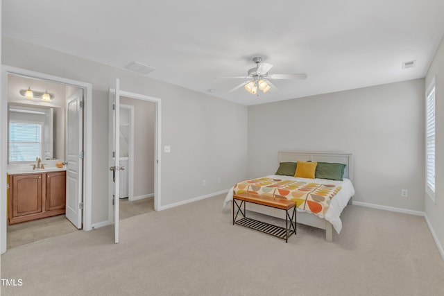 711 Keystone Park Dr Unit 7, Morrisville, NC 27560 - bedroom featuring light carpet, baseboards, a sink, ceiling fan, and connected bathroom