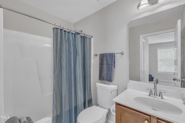 711 Keystone Park Dr Unit 7, Morrisville, NC 27560 - bathroom featuring toilet, vanity, and shower / bath combination with curtain