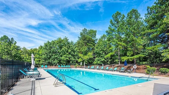 711 Keystone Park Dr Unit 7, Morrisville, NC 27560 - community pool with a patio and view of scattered trees