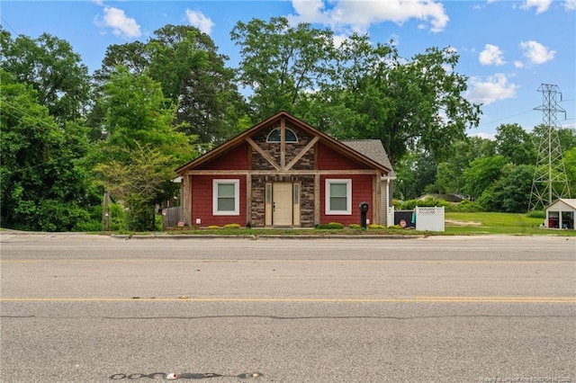 521 Cedar Creek Rd, Fayetteville, NC 28312 - view of front of home with stone siding and view of wooded area