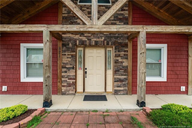 521 Cedar Creek Rd, Fayetteville, NC 28312 - doorway to property featuring stone siding