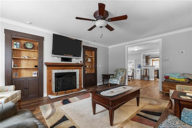 521 Cedar Creek Rd, Fayetteville, NC 28312 - living area featuring a ceiling fan, wood finished floors, crown molding, a fireplace, and built in features