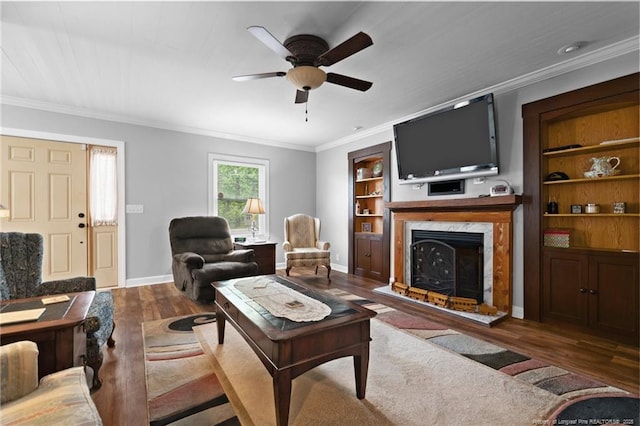 521 Cedar Creek Rd, Fayetteville, NC 28312 - living room with wood finished floors, ceiling fan, baseboards, a fireplace, and crown molding