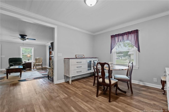 521 Cedar Creek Rd, Fayetteville, NC 28312 - dining area with wood finished floors, crown molding, baseboards, and a ceiling fan