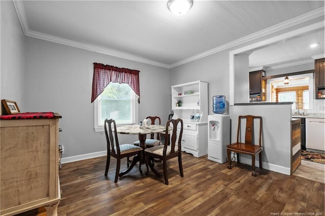 521 Cedar Creek Rd, Fayetteville, NC 28312 - dining space with healthy amount of natural light, dark wood-style flooring, crown molding, and baseboards