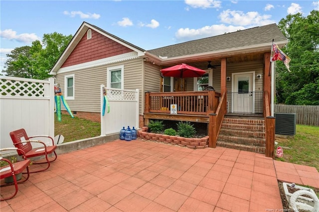 521 Cedar Creek Rd, Fayetteville, NC 28312 - back of property featuring a ceiling fan, a patio area, a porch, a playground, and roof with shingles