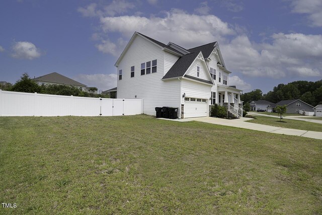view of home's exterior featuring a garage, concrete driveway, and a shingled roof