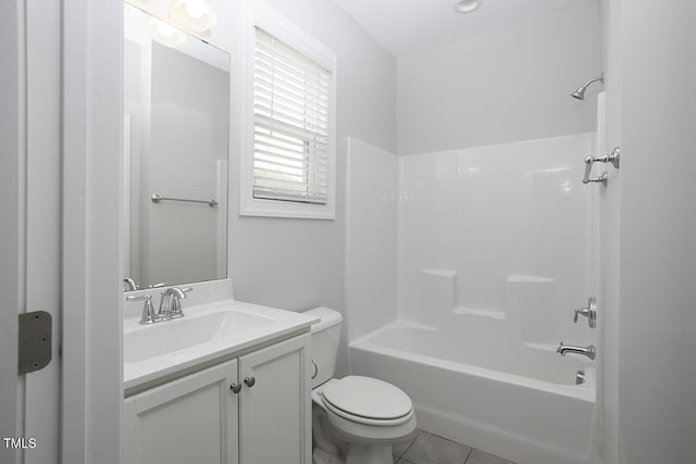 bathroom with toilet, vanity, shower / tub combination, and tile patterned flooring