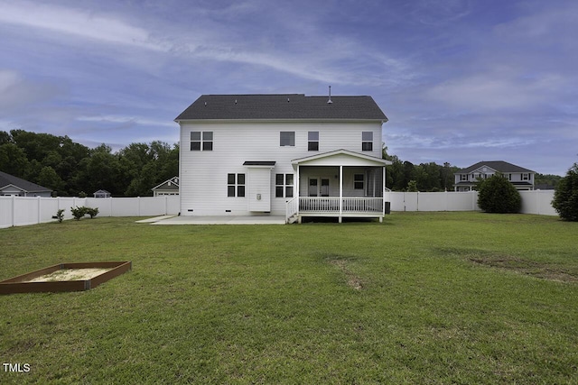 back of property with a patio