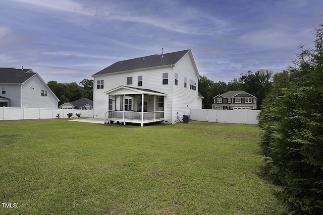 rear view of property with a sunroom, cooling unit, and roof with shingles