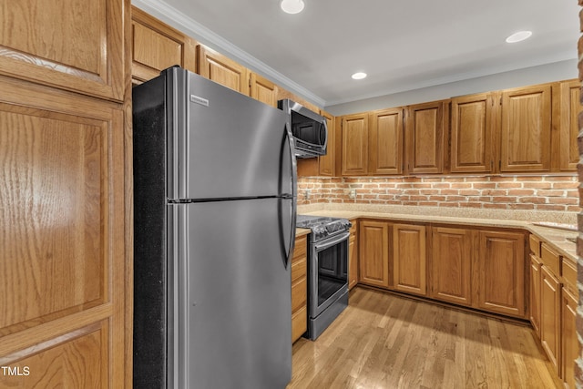 kitchen with stainless steel appliances, light wood-type flooring, ornamental molding, recessed lighting, and brown cabinetry