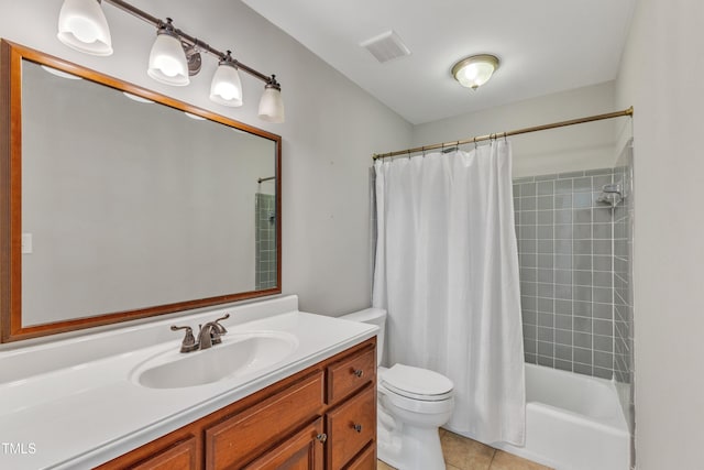 bathroom with toilet, tile patterned flooring, vanity, and shower / tub combo