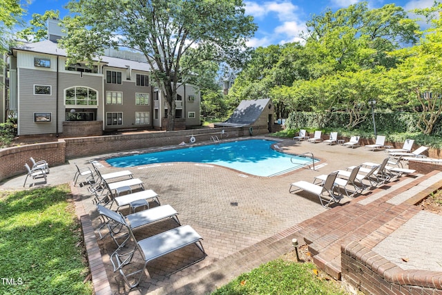 community pool featuring a patio area