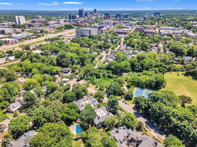 view of urban area featuring a tree filled landscape